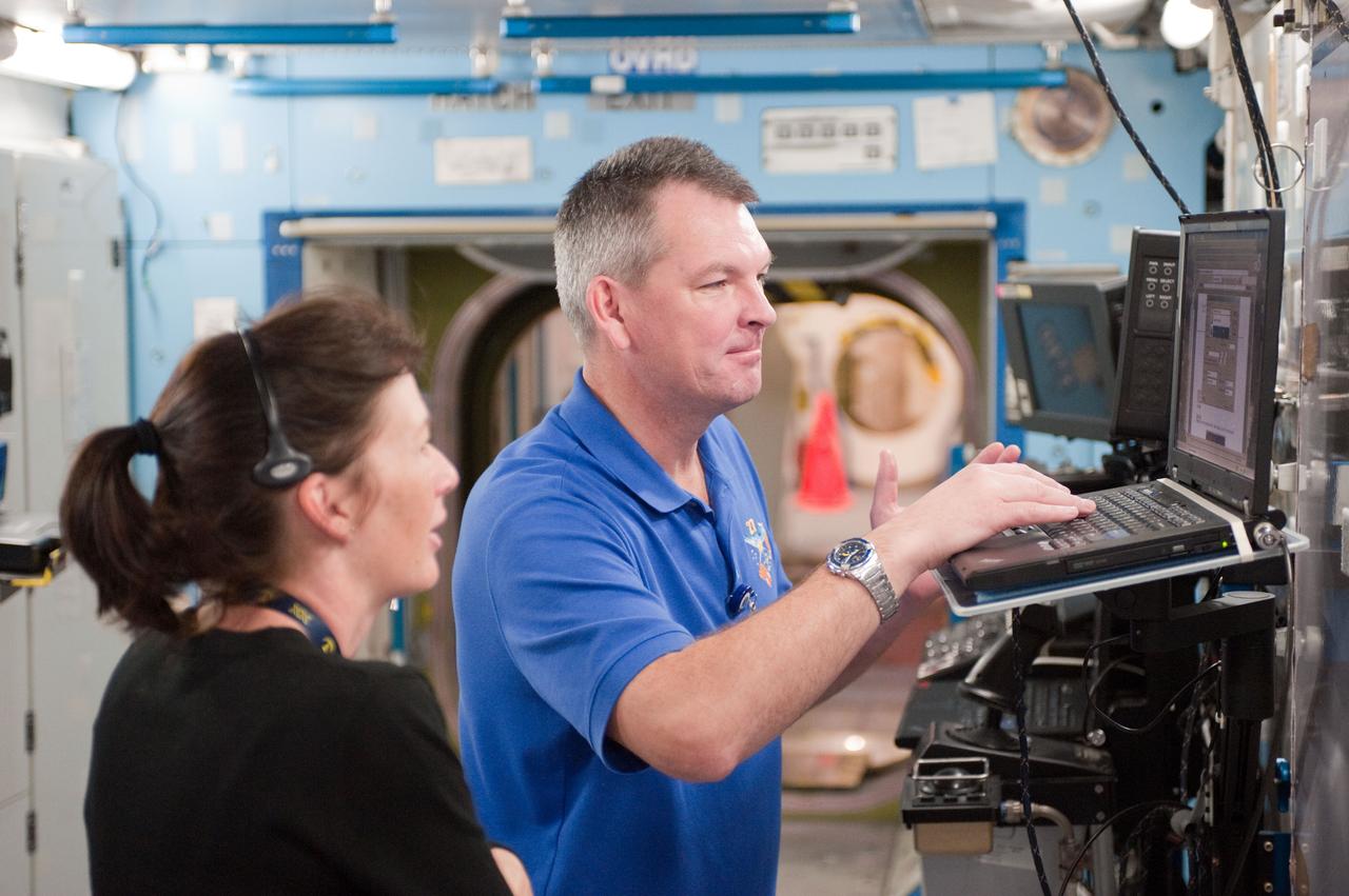 PHOTO DATE:  10-28-10 LOCATION:  Bldg 9NW, ISS Mockups SUBJECT:  Expedition 27 crew members Ron Garan, Andre Borisenko and Aleksandr Samokutyayev all working with instructors Nadine Lashier and Jennifer James during the crew's Routine Ops training PHOTOGRAPHER: James Blair 