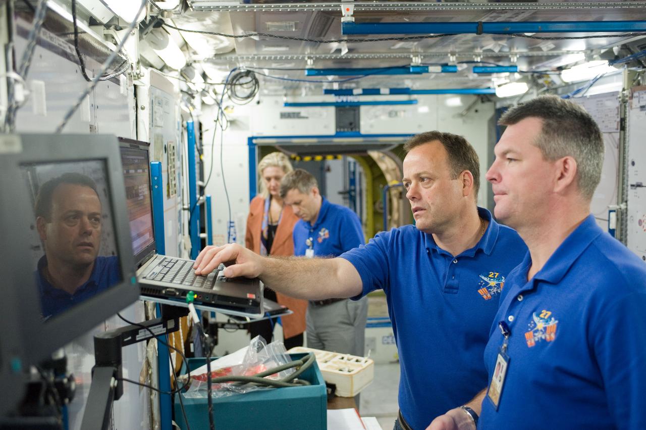 PHOTO DATE:  10-28-10 LOCATION:  Bldg 9NW, ISS Mockups SUBJECT:  Expedition 27 crew members Ron Garan, Andre Borisenko and Aleksandr Samokutyayev all working with instructors Nadine Lashier and Jennifer James during the crew's Routine Ops training PHOTOGRAPHER: James Blair 