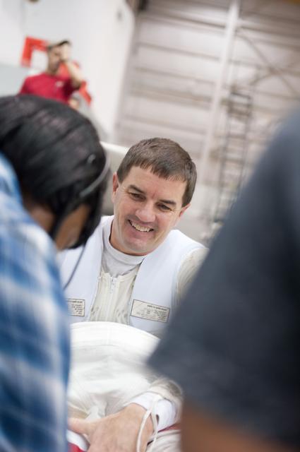NASA image: STS-335 (135) crew members Rex Walheim and Sandy Magnus  