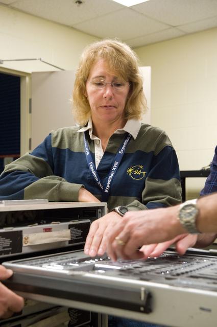 NASA image: STS-335 crew training, Tool/Repair Kits with instructor Jeff Stone   