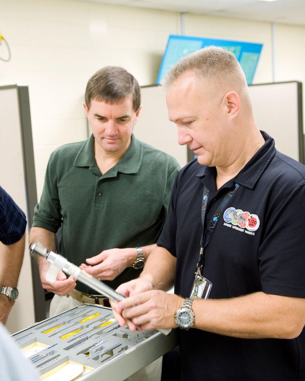 JSC2010-E-183217 (3 Nov. 2010) --- NASA astronauts Doug Hurley (right), STS-135 pilot; and Rex Walheim, mission specialist, participate in a tools and repair kits training session in the Space Vehicle Mock-up Facility at NASA's Johnson Space Center. STS-135 is planned to be the final mission of the space shuttle program. Photo credit: NASA or National Aeronautics and Space Administration