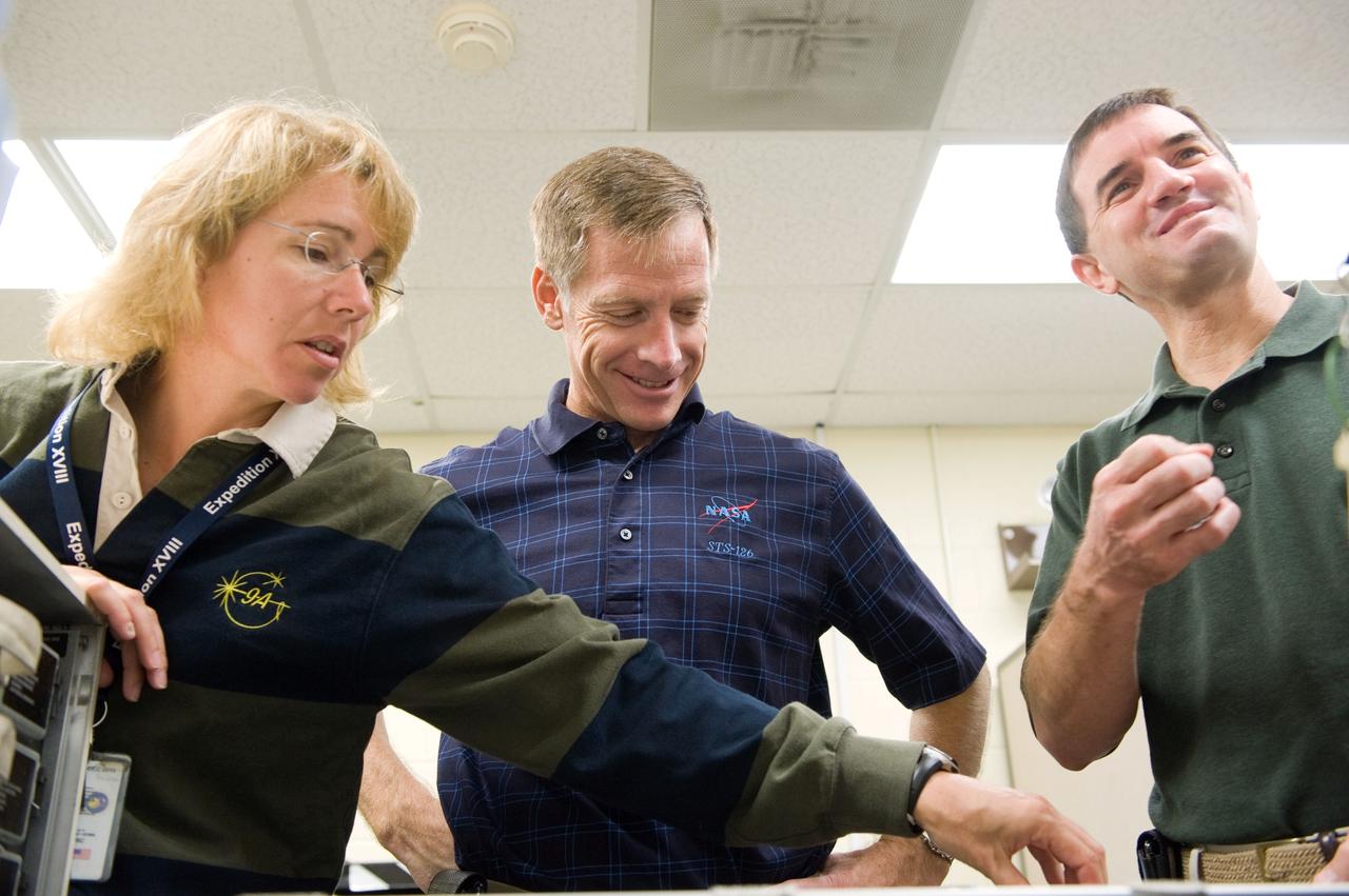 JSC2010-E-183219 (3 Nov. 2010) --- NASA astronauts Chris Ferguson (center), STS-135 commander; Sandra Magnus and Rex Walheim, both mission specialists, participate in a tools and repair kits training session in the Space Vehicle Mock-up Facility at NASA's Johnson Space Center. STS-135 is planned to be the final mission of the space shuttle program. Photo credit: NASA or National Aeronautics and Space Administration