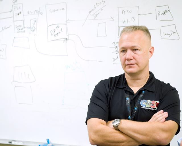 NASA image: STS-335 crew training, Tool/Repair Kits with instructor Jeff Stone   