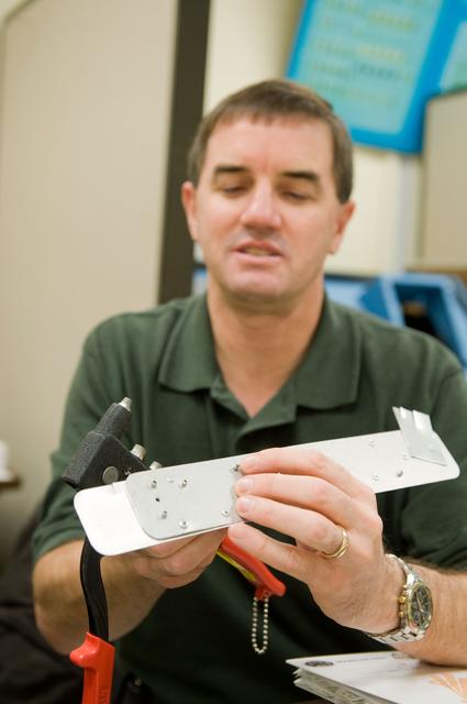 NASA image: STS-335 crew training, Tool/Repair Kits with instructor Jeff Stone   