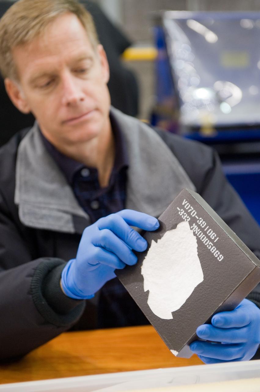 JSC2010-E-183521 (3 Nov. 2010) --- NASA astronaut Chris Ferguson, STS-135 commander, participates in an EVA Thermal Protection System (TPS) overview training session in the TPS/ Precision Air Bearing Facility in the Space Vehicle Mock-up Facility at NASA's Johnson Space Center. STS-135 is planned to be the final mission of the space shuttle program. Photo credit: NASA or National Aeronautics and Space Administration