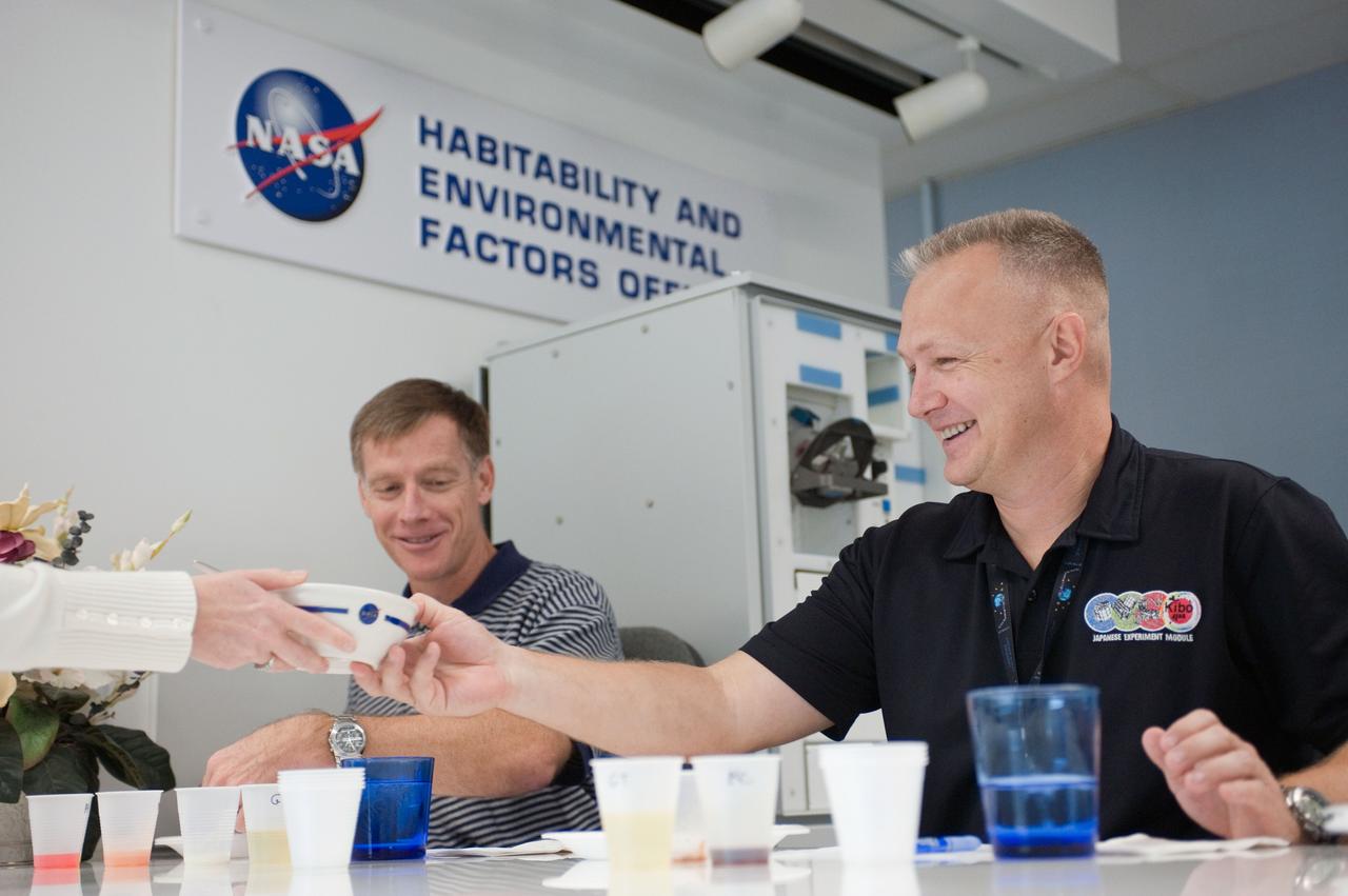 JSC2010-E-185486 (10 Nov. 2010) --- NASA astronauts Chris Ferguson (left), STS-135 commander; and Doug Hurley, pilot, participate in a food tasting session in the Habitability and Environmental Factors Office at NASA's Johnson Space Center. STS-135 is planned to be the final mission of the space shuttle program. Photo credit: NASA or National Aeronautics and Space Administration