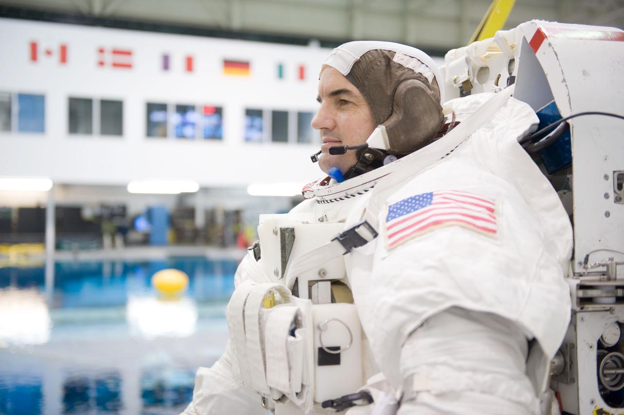 JSC2010-E-187206 (22 Nov. 2010) --- Attired in a training version of his Extravehicular Mobility Unit (EMU) spacesuit, NASA astronaut Rex Walheim, STS-135 mission specialist, awaits the start of a spacewalk training session in the waters of the Neutral Buoyancy Laboratory (NBL) near NASA's Johnson Space Center. STS-135 is planned to be the final mission of the space shuttle program. Photo credit: NASA or National Aeronautics and Space Administration