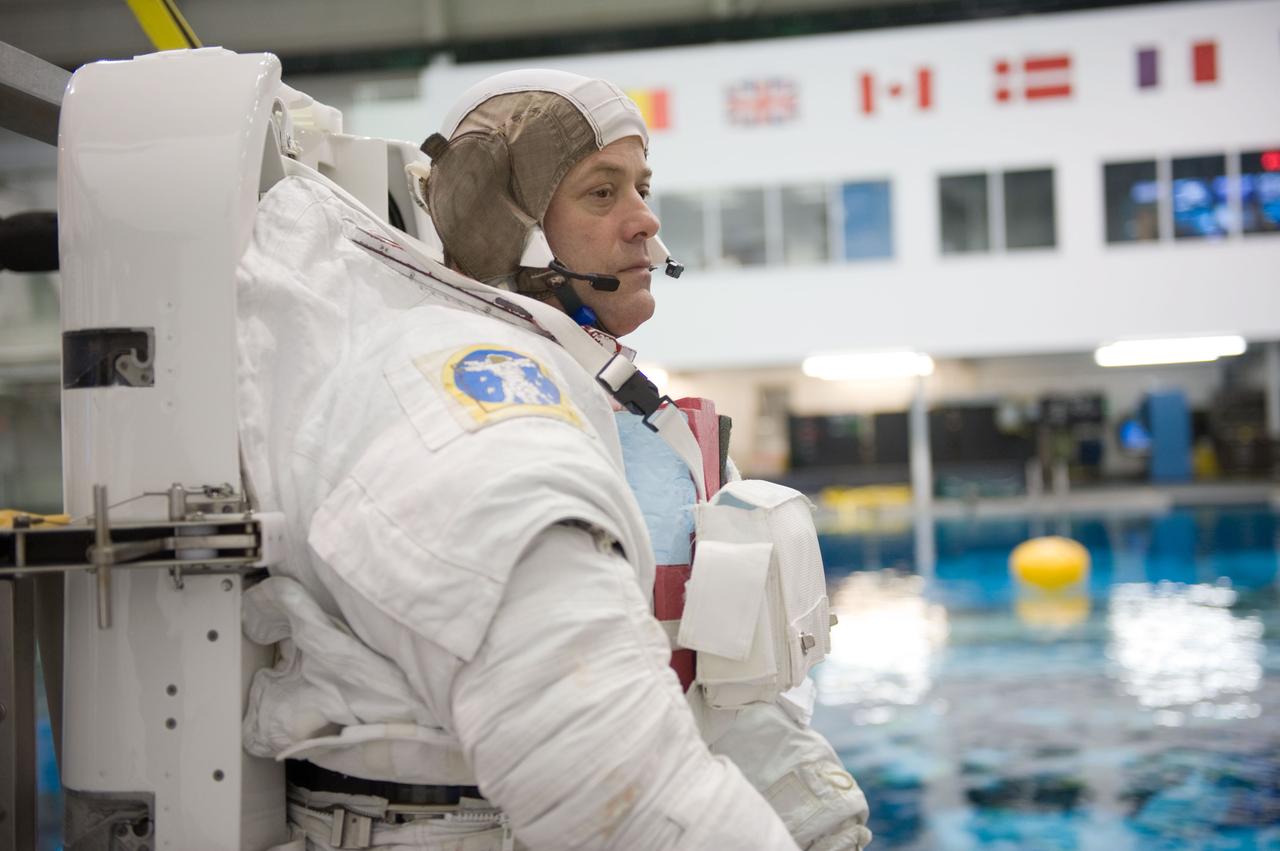JSC2010-E-187214 (22 Nov. 2010) --- NASA astronaut Ron Garan, Expedition 27/28 flight engineer, attired in a training version of his Extravehicular Mobility Unit (EMU) spacesuit, awaits the start of a spacewalk training session in the waters of the Neutral Buoyancy Laboratory (NBL) near NASA's Johnson Space Center. Photo credit: NASA or National Aeronautics and Space Administration