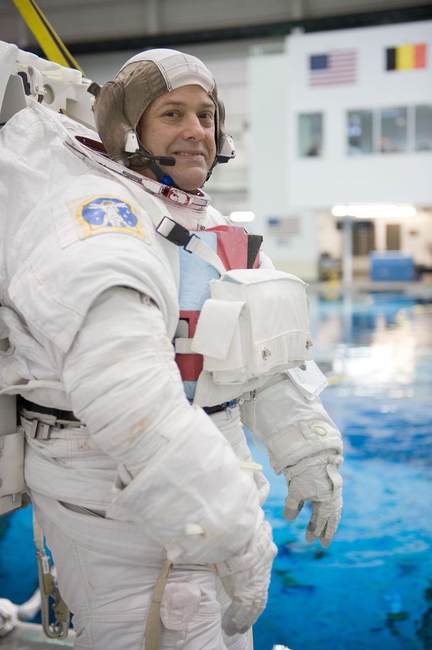 JSC2010-E-187215 (22 Nov. 2010) --- NASA astronaut Ron Garan, Expedition 27/28 flight engineer, attired in a training version of his Extravehicular Mobility Unit (EMU) spacesuit, awaits the start of a spacewalk training session in the waters of the Neutral Buoyancy Laboratory (NBL) near NASA's Johnson Space Center. Photo credit: NASA or National Aeronautics and Space Administration
