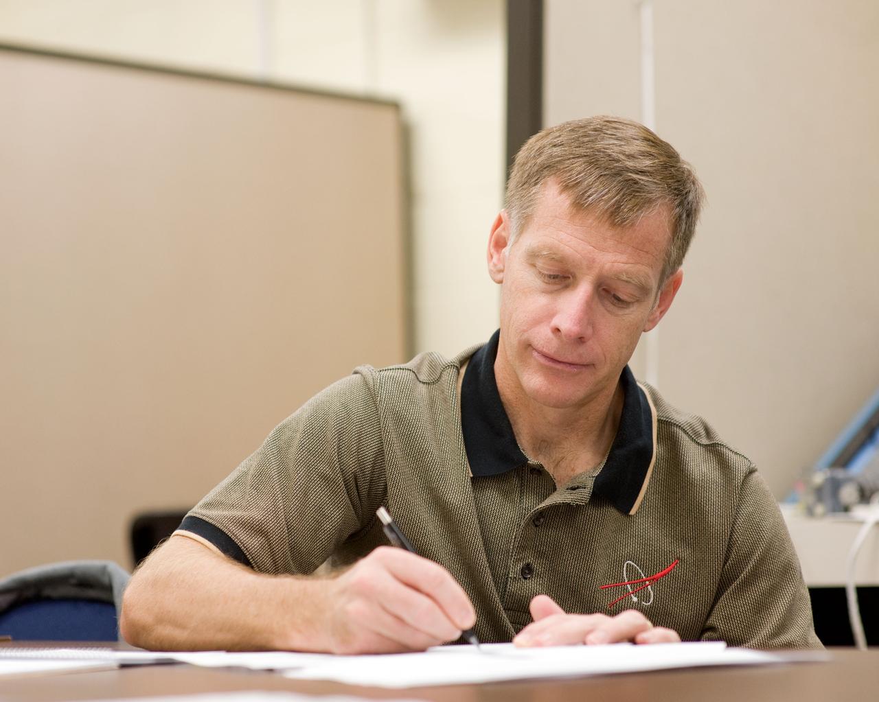 JSC2010-E-193582 (30 Nov. 2010) --- NASA astronaut Chris Ferguson, STS-135 commander, participates in a training session in the Space Vehicle Mock-up Facility at NASA's Johnson Space Center. STS-135 is planned to be the final mission of the space shuttle program. Photo credit: NASA or National Aeronautics and Space Administration