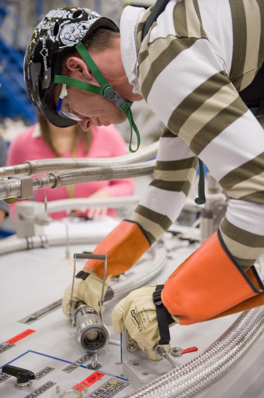 JSC2010-E-193901 (1 Dec. 2010) --- NASA astronaut Andrew Feustel, STS-134 mission specialist, participates in an extravehicular activity (EVA) training session in the Partial Gravity Simulator (POGO) test area in the Space Vehicle Mock-up Facility at NASA?s Johnson Space Center. Photo credit: NASA or National Aeronautics and Space Administration