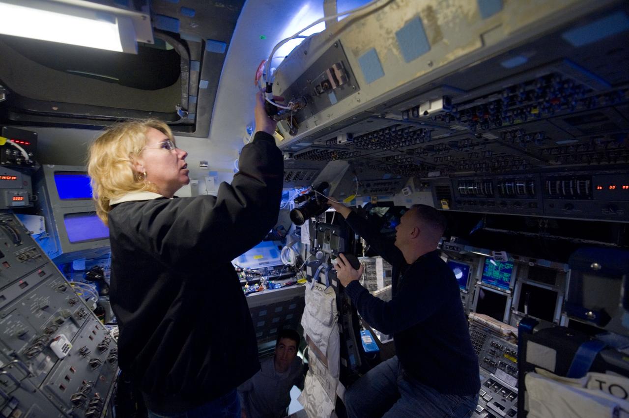 JSC2010-E-193961 (2 Dec. 2010) --- NASA astronauts Doug Hurley, STS-135 pilot; and Sandy Magnus, mission specialist, participate in a training session in the fixed-base shuttle mission simulator (SMS) in the Jake Garn Simulation and Training Facility at NASA's Johnson Space Center. STS-135 is planned to be the final mission of the space shuttle program. Photo credit: NASA or National Aeronautics and Space Administration