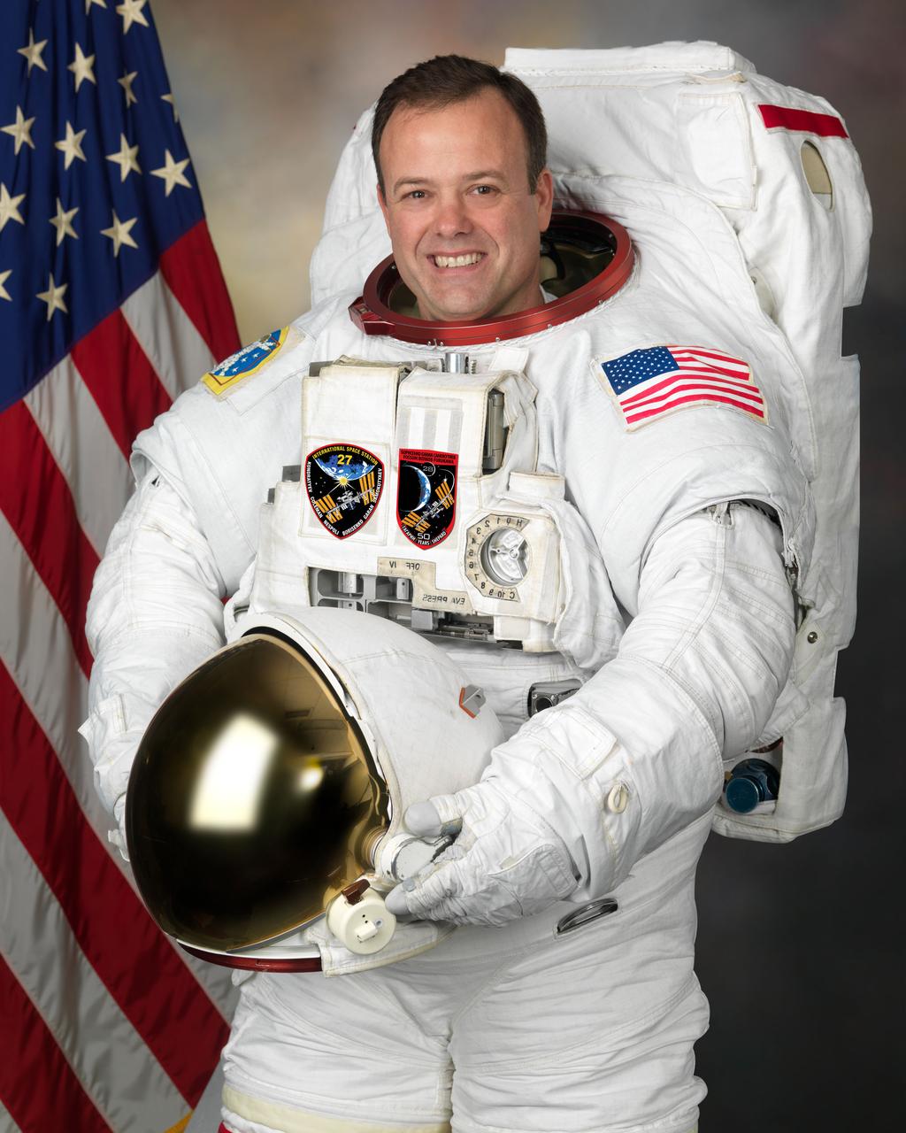 Official Astronaut Portrait of Ron Garan - Individual EMU Portrait.  Photo Date: November 30, 2010.  Location: Building 8, Room 272 - Photo Studio.  Photographer: Robert Markowitz.