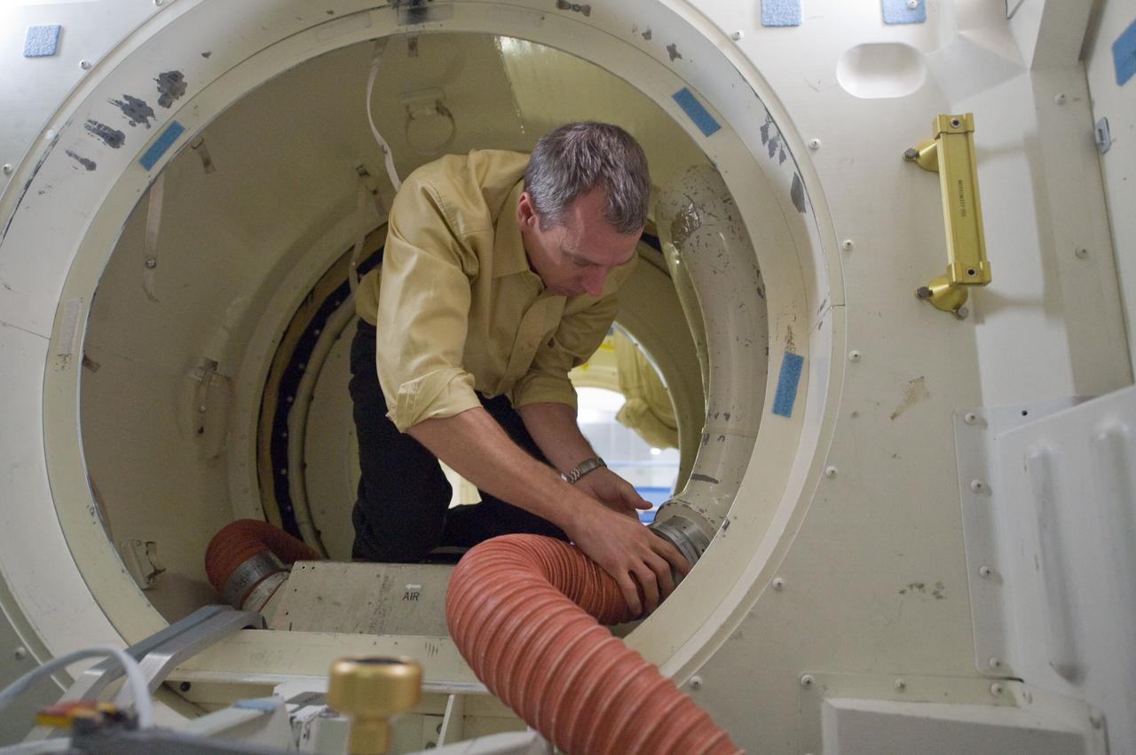 JSC2010-E-194290 (4 Dec. 2010) --- NASA astronaut Andrew Feustel, STS-134 mission specialist, participates in an ingress/egress training session in the Space Vehicle Mock-up Facility at NASA's Johnson Space Center. Photo credit: NASA or National Aeronautics and Space Administration