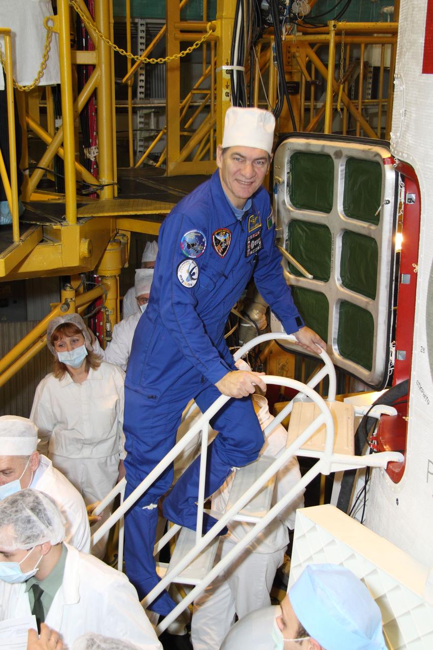 Nespoli climbs stairs in Integration Facility for final inspection of Soyuz TMA-20. -NASA/Victor Zelentsov
