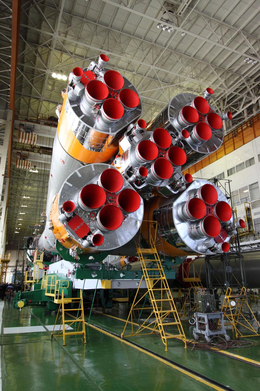 View of the engines of the first stage of the Soyuz TMA-20 booster rocket during mating operations on December 12, 2010 at the Baikonur Cosmodrome in Kazakhstan in advance of the launch of the Expedition 26 crew, Kondratyev, Coleman and Nespoli, on December 16, Baikonur time, to the International Space Station.  -NASA/Victor Zelentsov