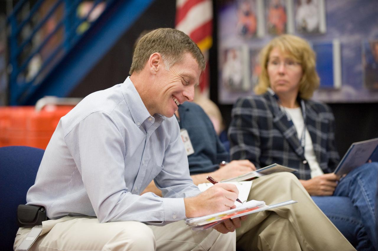 JSC2010-E-195517 (3 Dec. 2010) --- NASA astronauts Chris Ferguson, STS-135 commander; Rex Walheim (mostly obscured) and Sandy Magnus, both mission specialists, are pictured during an emergency egress training session in the Space Vehicle Mock-up Facility at NASA's Johnson Space Center. STS-135 is planned to be the final mission of the space shuttle program. Photo credit: NASA or National Aeronautics and Space Administration