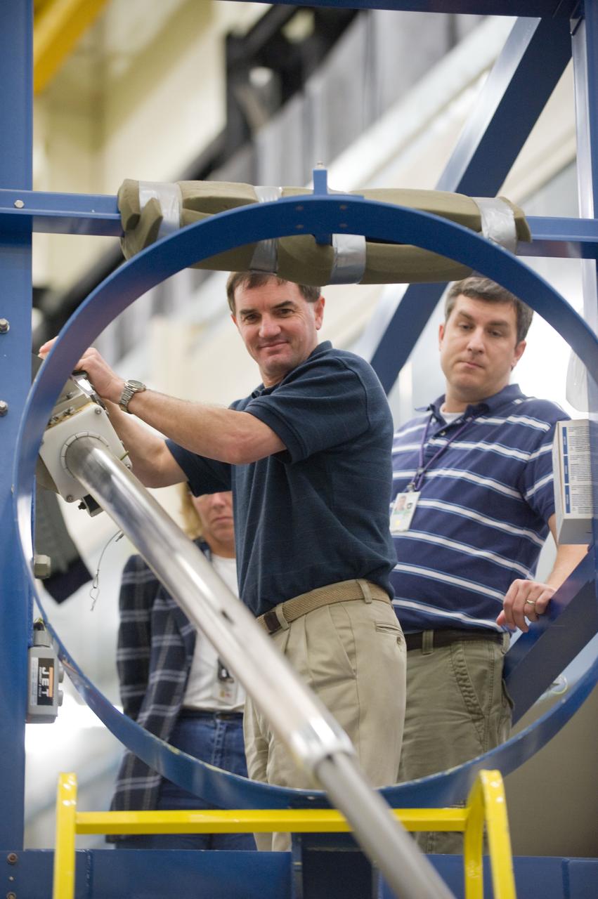JSC2010-E-195521 (3 Dec. 2010) --- NASA astronaut Rex Walheim (left), STS-135 mission specialist, participates in an emergency egress training session in the Space Vehicle Mock-up Facility at NASA's Johnson Space Center. Crew instructor Patrick Jones assisted Walheim. STS-135 is planned to be the final mission of the space shuttle program. Photo credit: NASA or National Aeronautics and Space Administration