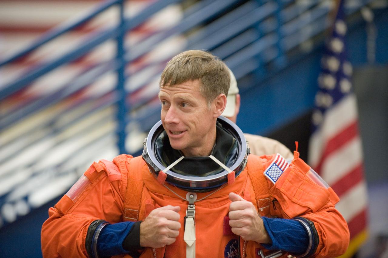 JSC2010-E-195524 (3 Dec. 2010) --- NASA astronaut Chris Ferguson, STS-135 commander, dons a training version of his shuttle launch and entry suit in preparation for an emergency egress training session in the Space Vehicle Mock-up Facility at NASA's Johnson Space Center. STS-135 is planned to be the final mission of the space shuttle program. Photo credit: NASA or National Aeronautics and Space Administration
