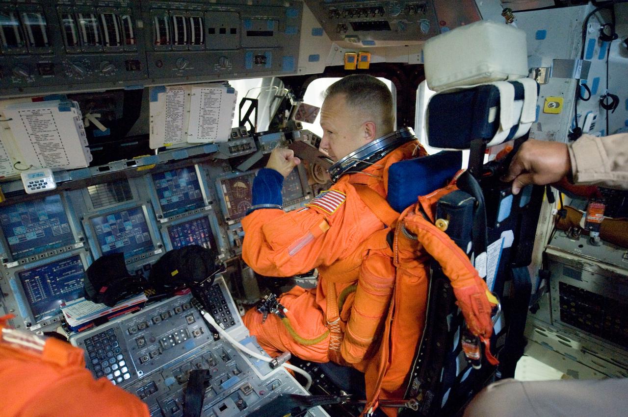 JSC2010-E-195530 (3 Dec. 2010) --- While seated at the pilot?s station, NASA astronaut Doug Hurley, STS-135 pilot, participates in a training session in the crew compartment trainer (CCT-2) in the Space Vehicle Mock-up Facility at NASA's Johnson Space Center. Hurley is wearing a training version of his shuttle launch and entry suit. STS-135 is planned to be the final mission of the space shuttle program. Photo credit: NASA or National Aeronautics and Space Administration