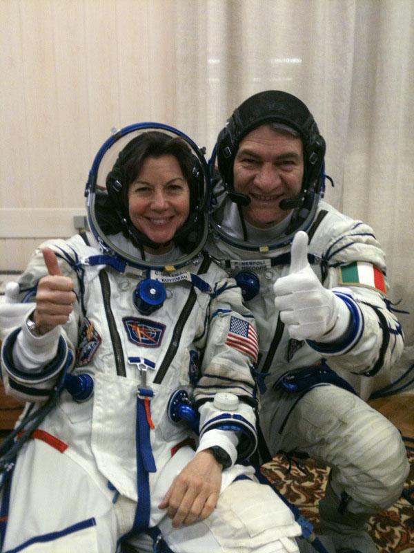 (16 Dec. 2010) --- At the Baikonur Cosmodrome in Kazakhstan, NASA astronaut Catherine (CadY) Coleman and European Space Agency astronaut Paolo Nespoli, both Expedition 26 flight engineers, give a thumbs up signal just prior to walkout leading up to today's (Dec. 16 Kazakhstan time) launch aboard the Soyuz TMA 20.  Soyuz commander Dmitry Kondratyev of Roscosmos is out of frame.  Photo credit: NASA 