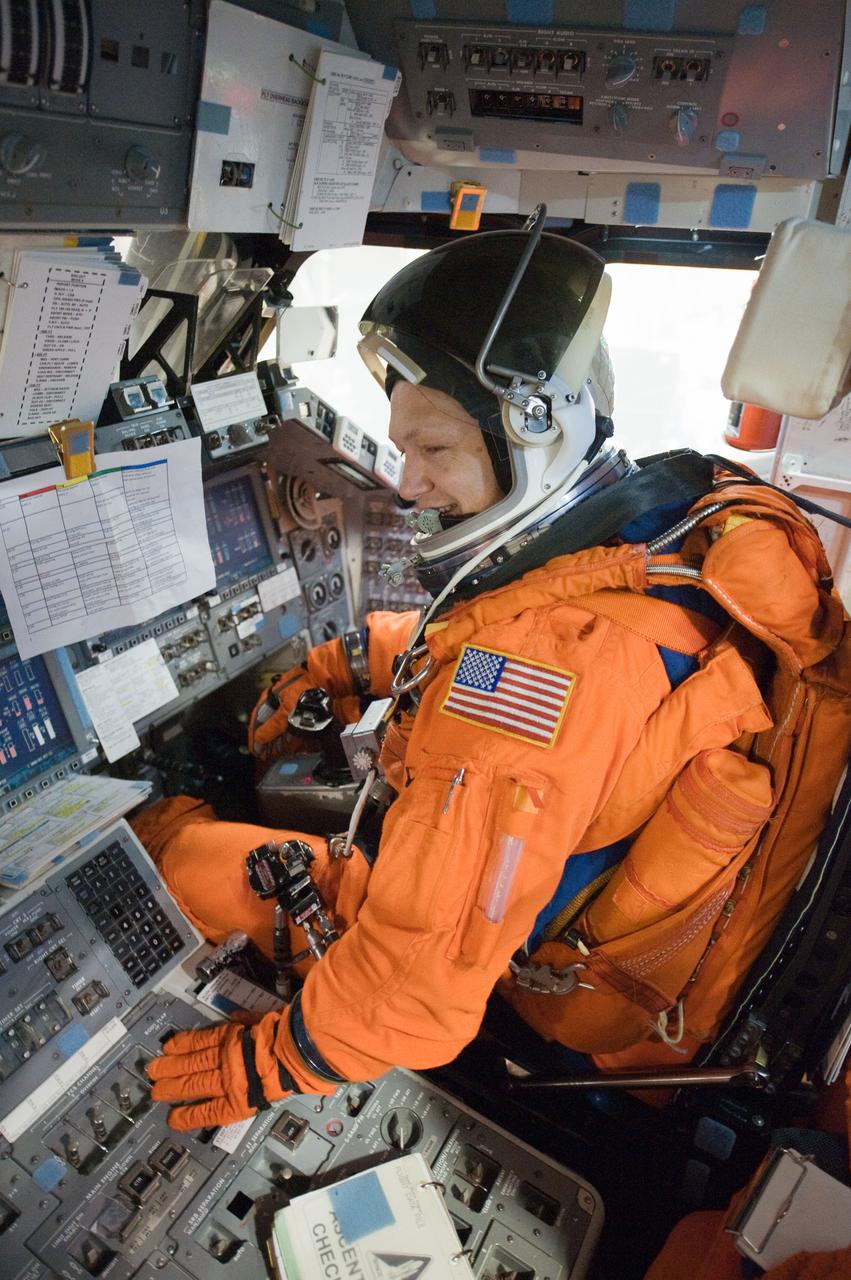 JSC2010-E-196893 (20 Dec. 2010) --- While seated at the pilot?s station, NASA astronaut Doug Hurley, STS-135 pilot, participates in a post insertion/de-orbit training session on the flight deck of the crew compartment trainer (CCT-2) in the Space Vehicle Mockup Facility at NASA's Johnson Space Center. Hurley is wearing a training version of his shuttle launch and entry suit. STS-135 is planned to be the final mission of the space shuttle program. Photo credit: NASA or National Aeronautics and Space Administration