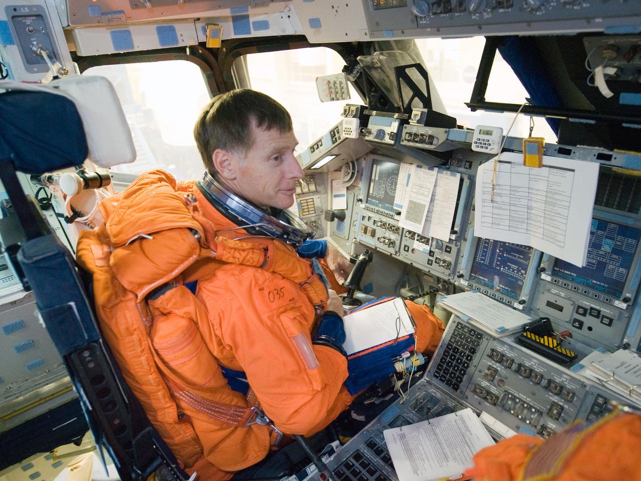 JSC2010-E-196897 (20 Dec. 2010) --- While seated at the commander?s station, NASA astronaut Chris Ferguson, STS-135 commander, participates in a post insertion/de-orbit training session on the flight deck of the crew compartment trainer (CCT-2) in the Space Vehicle Mockup Facility at NASA's Johnson Space Center. Ferguson is wearing a training version of his shuttle launch and entry suit. STS-135 is planned to be the final mission of the space shuttle program. Photo credit: NASA or National Aeronautics and Space Administration