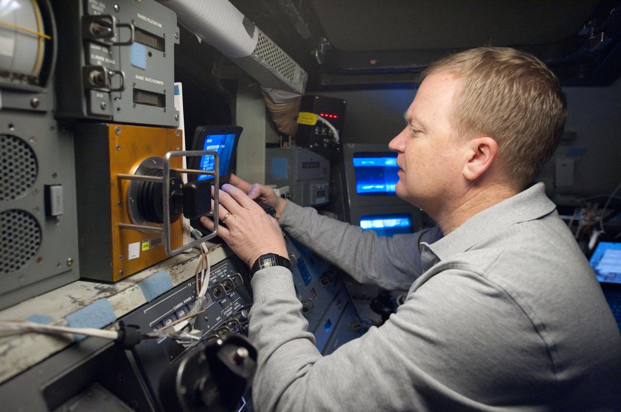 JSC2011-E-003045 (14 Jan. 2011) --- NASA astronaut Eric Boe, STS-133 pilot, participates in a training session in the fixed-base shuttle mission simulator (SMS) in the Jake Garn Simulation and Training Facility at NASA's Johnson Space Center. Photo credit: NASA or National Aeronautics and Space Administration