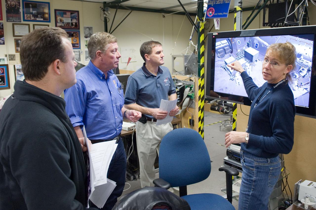 JSC2011-E-003206 (18 Jan. 2011) --- NASA astronauts Ron Garan (left foreground), Expedition 27/28 flight engineer; Mike Fossum (second left), Expedition 28 flight engineer and Expedition 29 commander; Rex Walheim and Sandy Magnus, both STS-135 mission specialists, use the virtual reality lab in the Space Vehicle Mock-up Facility at NASA's Johnson Space Center to train for some of their duties aboard the space shuttle and space station. This type of computer interface, paired with virtual reality training hardware and software, helps to prepare crew members for dealing with space station elements. STS-135 is planned to be the final mission of the space shuttle program. Photo credit: NASA or National Aeronautics and Space Administration
