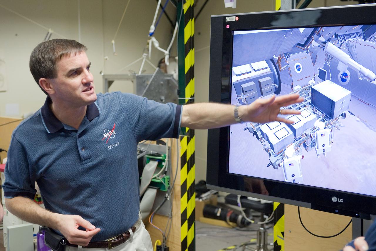 JSC2011-E-003207 (18 Jan. 2011) --- NASA astronaut Rex Walheim, STS-135 mission specialist, uses the virtual reality lab in the Space Vehicle Mock-up Facility at NASA's Johnson Space Center to train for some of his duties aboard the space shuttle and space station. This type of computer interface, paired with virtual reality training hardware and software, helps to prepare crew members for dealing with space station elements. STS-135 is planned to be the final mission of the space shuttle program. Photo credit: NASA or National Aeronautics and Space Administration