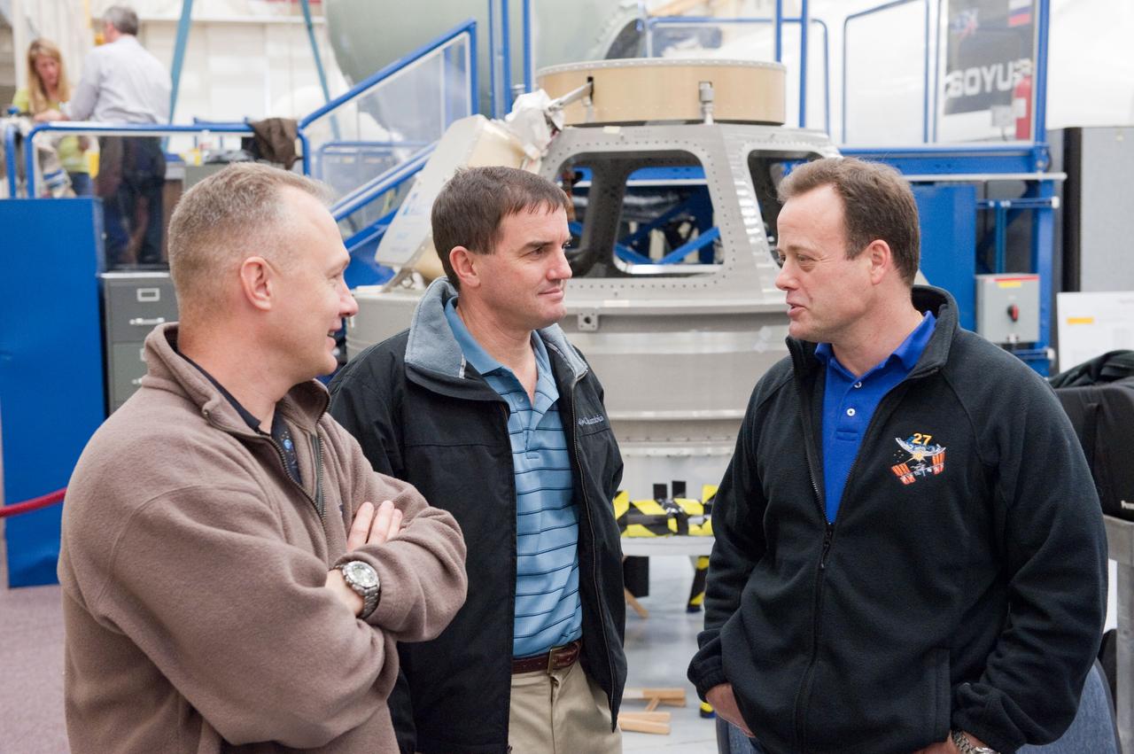 JSC2011-E-005854 (19 Jan. 2011) --- NASA astronauts Doug Hurley (left), STS-135 pilot; Rex Walheim (center), STS-135 mission specialist; and Ron Garan, Expedition 27/28 flight engineer, are pictured during a joint emergency scenarios training session in the Space Vehicle Mock-up Facility at NASA's Johnson Space Center. STS-135 is planned to be the final mission of the space shuttle program. Photo credit: NASA or National Aeronautics and Space Administration