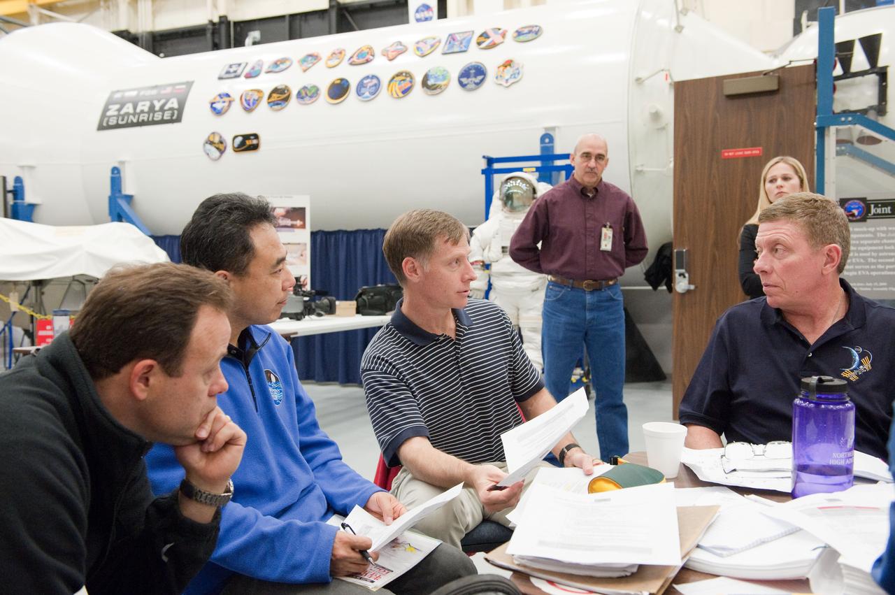 JSC2011-E-005863 (19 Jan. 2011) --- NASA astronauts Chris Ferguson (second right), STS-135 commander; Mike Fossum (right), Expedition 28 flight engineer and Expedition 29 commander; Ron Garan (left), Expedition 27/28 flight engineer; and Japan Aerospace Exploration Agency (JAXA) astronaut Satoshi Furukawa, Expedition 28/29 flight engineer, participate in a joint emergency scenarios training session in the Space Vehicle Mock-up Facility at NASA's Johnson Space Center. STS-135 is planned to be the final mission of the space shuttle program. Photo credit: NASA or National Aeronautics and Space Administration