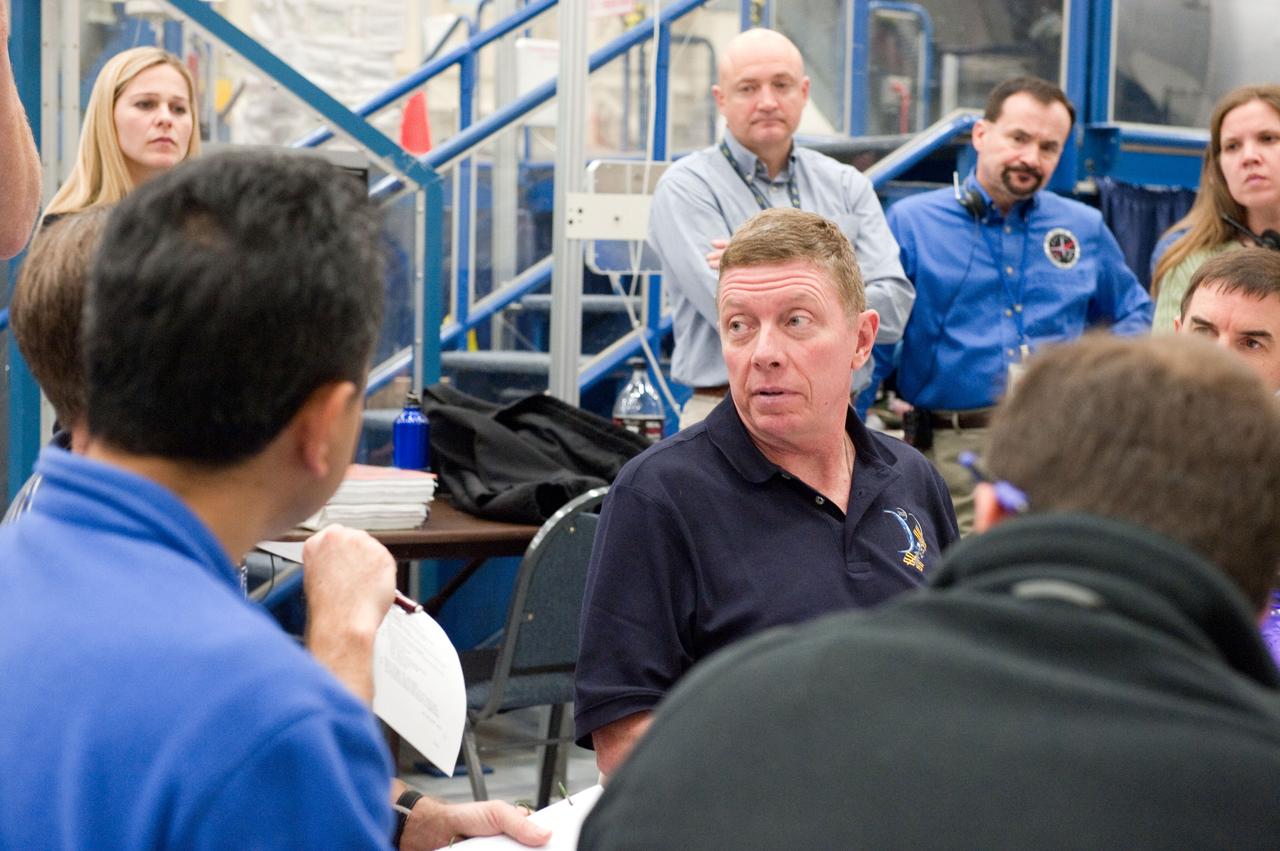 JSC2011-E-005864 (19 Jan. 2011) --- NASA astronaut Mike Fossum (facing camera), Expedition 28 flight engineer and Expedition 29 commander, participates in an emergency scenarios training session in the Space Vehicle Mock-up Facility at NASA's Johnson Space Center. Photo credit: NASA or National Aeronautics and Space Administration