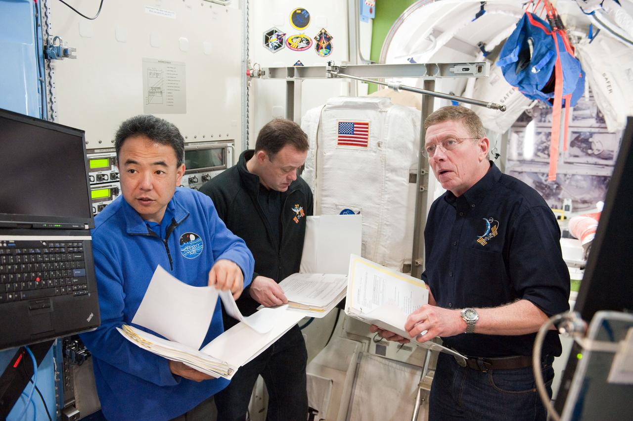 PHOTO DATE:  01-25-11 LOCATION: Bldg 9NW,  ISS Mockups SUBJECT:  Expedition 28 crew member and JAXA astronaut Satoshi Furukawa during ISS EVA P/P 33105 training with STS-135 crew members PHOTOGRAPHER:  James Blair 