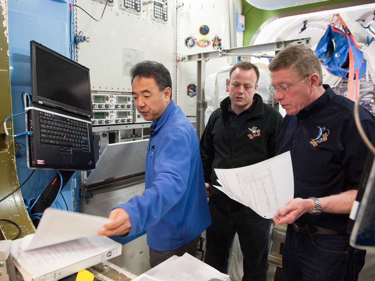 PHOTO DATE:  01-25-11 LOCATION: Bldg 9NW,  ISS Mockups SUBJECT:  Expedition 28 crew member and JAXA astronaut Satoshi Furukawa during ISS EVA P/P 33105 training with STS-135 crew members PHOTOGRAPHER:  James Blair 