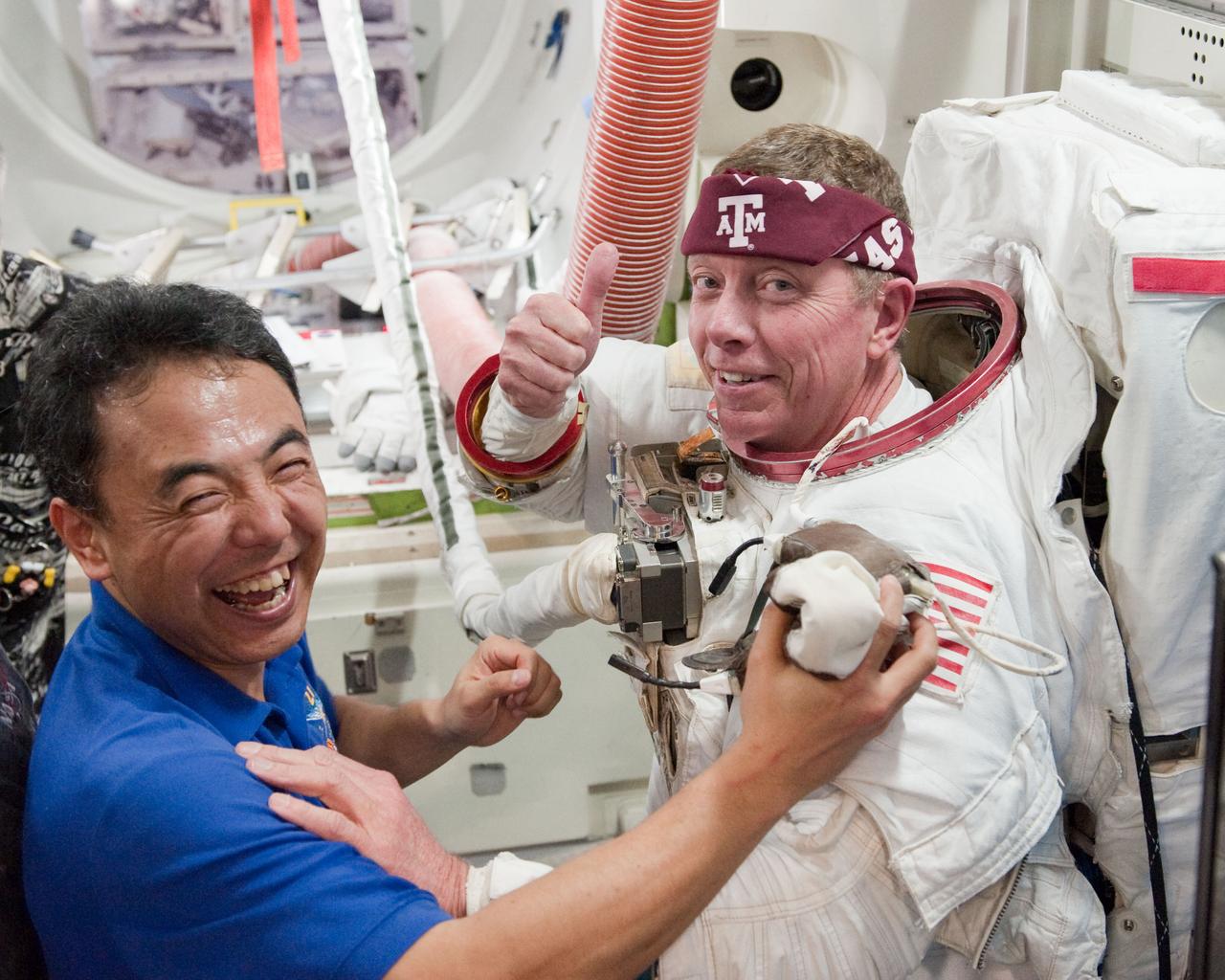 PHOTO DATE:  01-25-11 LOCATION: Bldg 9NW,  ISS Mockups SUBJECT:  Expedition 28 crew member and JAXA astronaut Satoshi Furukawa during ISS EVA P/P 33105 training with STS-135 crew members PHOTOGRAPHER:  James Blair 