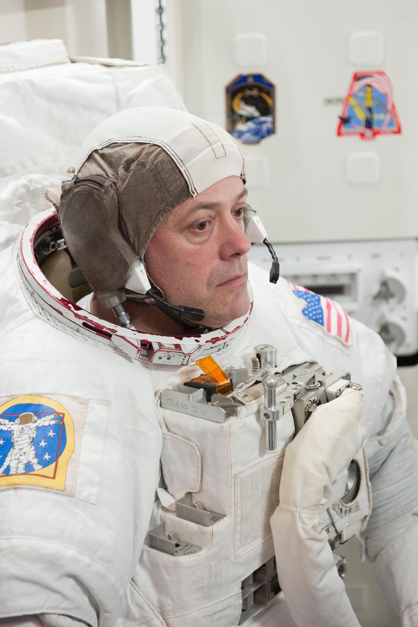 PHOTO DATE:  01-25-11 LOCATION: Bldg 9NW,  ISS Mockups SUBJECT:  Expedition 28 crew member and JAXA astronaut Satoshi Furukawa during ISS EVA P/P 33105 training with STS-135 crew members PHOTOGRAPHER:  James Blair 