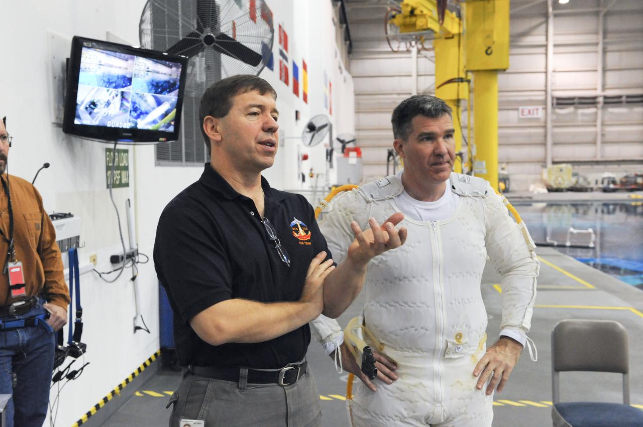 JSC2011-E-013860 (28 Jan. 2011) --- NASA astronauts Michael Barratt (left) and Steve Bowen, both STS-133 mission specialists, are pictured prior to the start of a spacewalk training session in the waters of the Neutral Buoyancy Laboratory (NBL) near NASA's Johnson Space Center. Bowen is wearing a liquid cooling and ventilation garment that complements the Extravehicular Mobility Unit (EMU) spacesuit. Photo credit: NASA or National Aeronautics and Space Administration