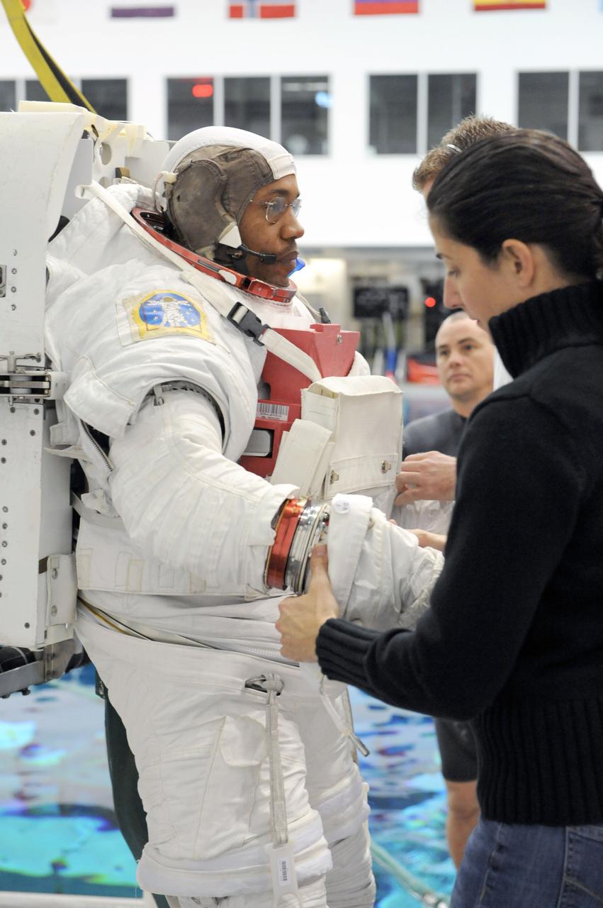 PHOTO DATE: 28 January 2011, LOCATION: NBL - Pool Topside, SUBJECT: STS-133 Crew members Steve Bowen and Benjamin Drew during EVA 2 training with Mike Barratt and Nicole Stott assisting. PHOTOGRAPHER: Mark Sowa