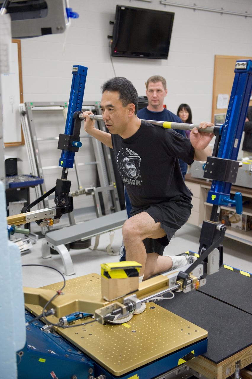 PHOTO DATE:  02-03-11 LOCATION: Bldg 26, 104 SUBJECT: Photograph JAXA astronaut and Expedition 28 crew member Satoshi Furukawa during ARED PT training. Instructors are Robert Tweedy (glasses) and BruceNieschwitz PHOTOGRAPHER:  James Blair