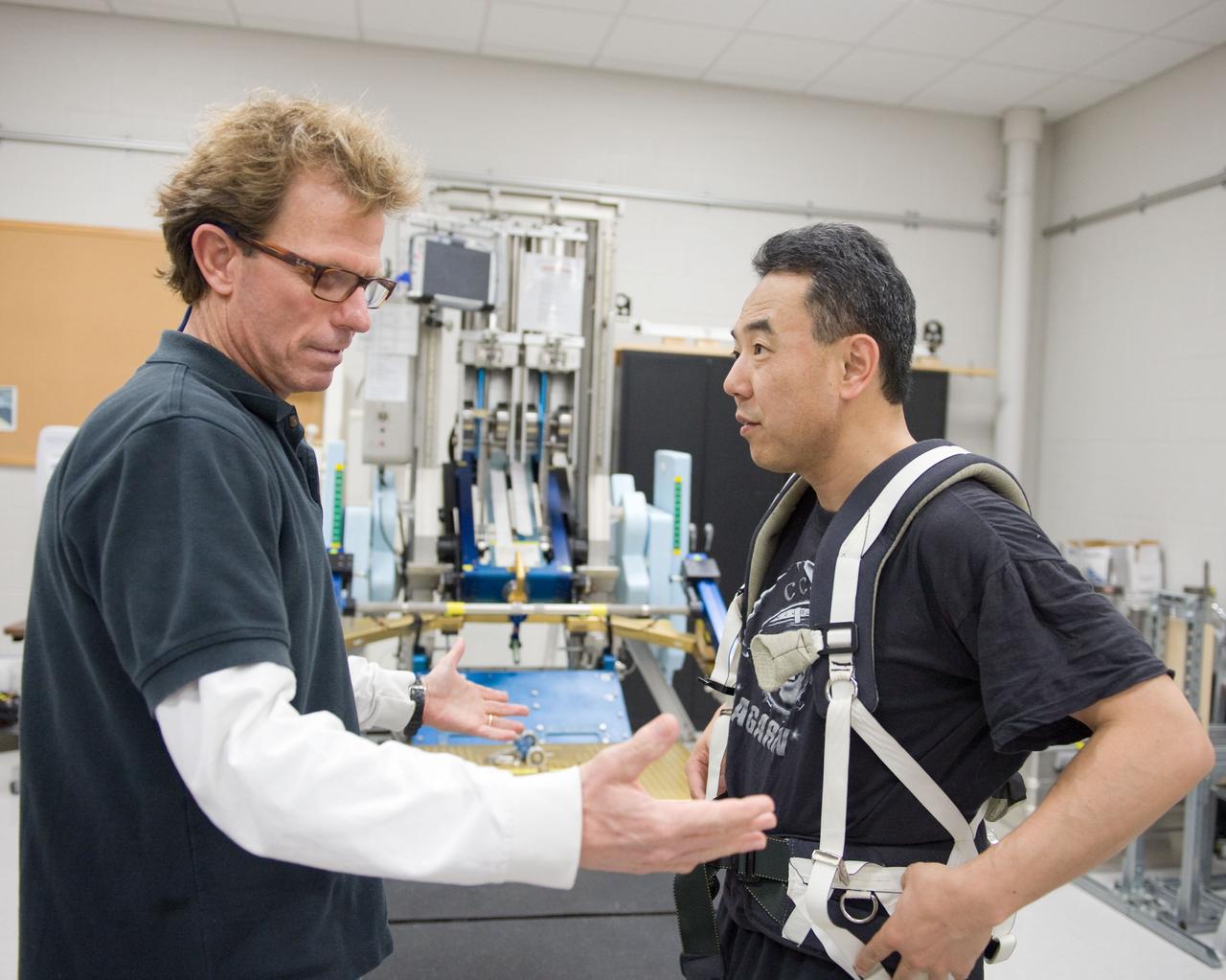 PHOTO DATE:  02-03-11 LOCATION: Bldg 26, 104 SUBJECT: Photograph JAXA astronaut and Expedition 28 crew member Satoshi Furukawa during ARED PT training. Instructors are Robert Tweedy (glasses) and BruceNieschwitz PHOTOGRAPHER:  James Blair