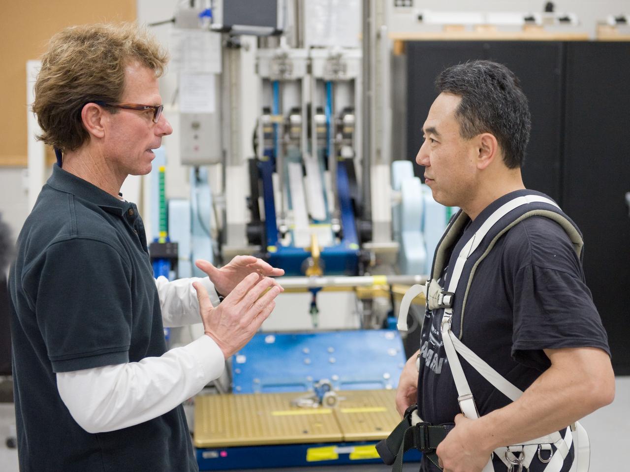 PHOTO DATE:  02-03-11 LOCATION: Bldg 26, 104 SUBJECT: Photograph JAXA astronaut and Expedition 28 crew member Satoshi Furukawa during ARED PT training. Instructors are Robert Tweedy (glasses) and BruceNieschwitz PHOTOGRAPHER:  James Blair