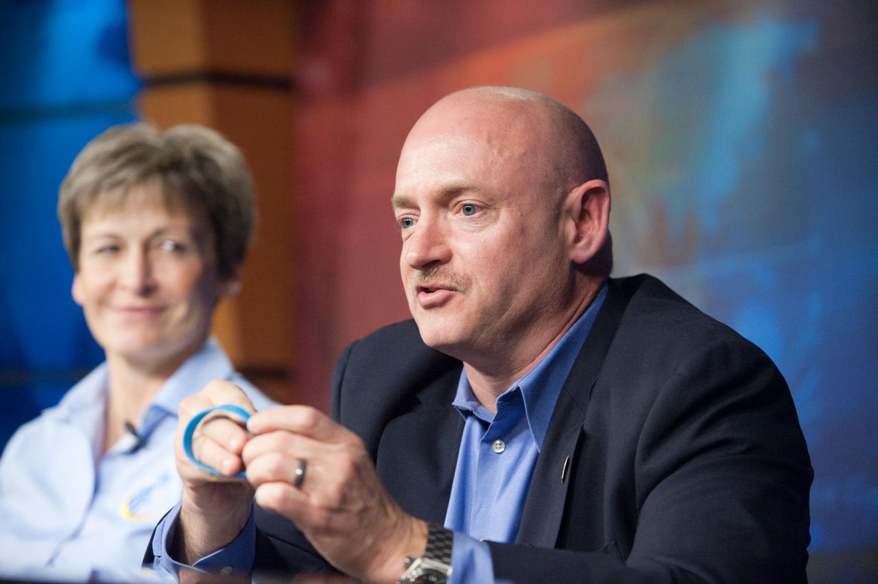 JSC2011-E-015245 (4 Feb. 2011) --- NASA astronaut Mark Kelly, STS-134 commander, describes a blue wristband to reporters during a news conference at NASA's Johnson Space Center. The briefing was held to discuss Kelly resuming training as the STS-134 shuttle mission commander. With the exception of some proficiency training, Kelly has been on personal leave since Jan. 8 to care for his wife, congresswoman Gabrielle Giffords, who was critically wounded in a Tucson, Ariz. shooting. The wristband, which has a peace sign, heart and ?Gabby,? was delivered by Giffords? office. Photo credit: NASA or National Aeronautics and Space Administration