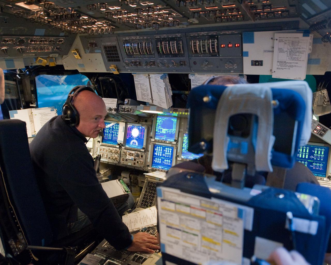 JSC2011-E-016861 (11 Feb. 2011) --- NASA astronaut Mark Kelly, STS-134 commander, occupies the commander's station during a simulation exercise in the motion-base shuttle mission simulator in the Jake Garn Mission and Simulation Training Facility at NASA's Johnson Space Center. Photo credit: NASA or National Aeronautics and Space Administration