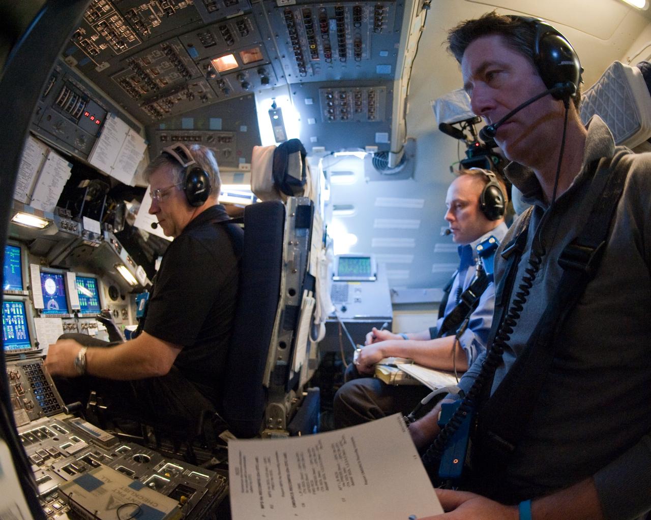 JSC2011-E-016869 (11 Feb. 2011) --- NASA astronaut Gregory H. Johnson (left), STS-134 pilot, along with European Space Agency astronaut Roberto Vittori (foreground) and NASA astronaut Michael Fincke, both mission specialists, participate in a simulation exercise in the motion-base simulator in the Jake Garn Simulation and Training Facility at NASA's Johnson Space Center. Photo credit: NASA or National Aeronautics and Space Administration