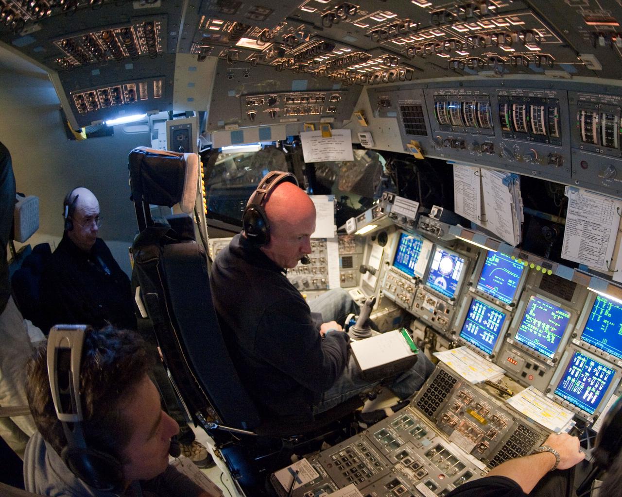 JSC2011-E-016874 (11 Feb. 2011) --- NASA astronaut Mark Kelly (right foreground), STS-134 commander, and European Space Agency astronaut Roberto Vittori (left foreground), mission specialist, participate in a simulation exercise in the motion-base shuttle mission simulator in the Jake Garn Simulation and Training Facility at NASA's Johnson Space Center. Photo credit: NASA or National Aeronautics and Space Administration