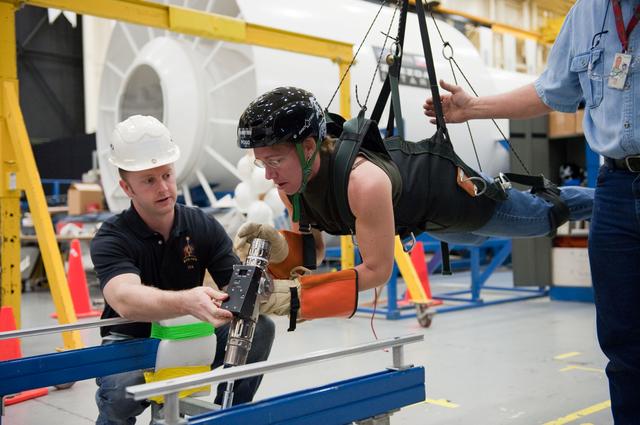 NASA image: STS-135 crew members Rex Walheim and Sandra Magnus