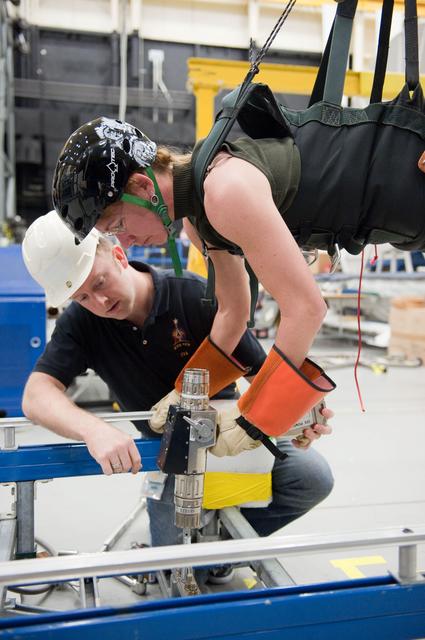 NASA image: STS-135 crew members Rex Walheim and Sandra Magnus