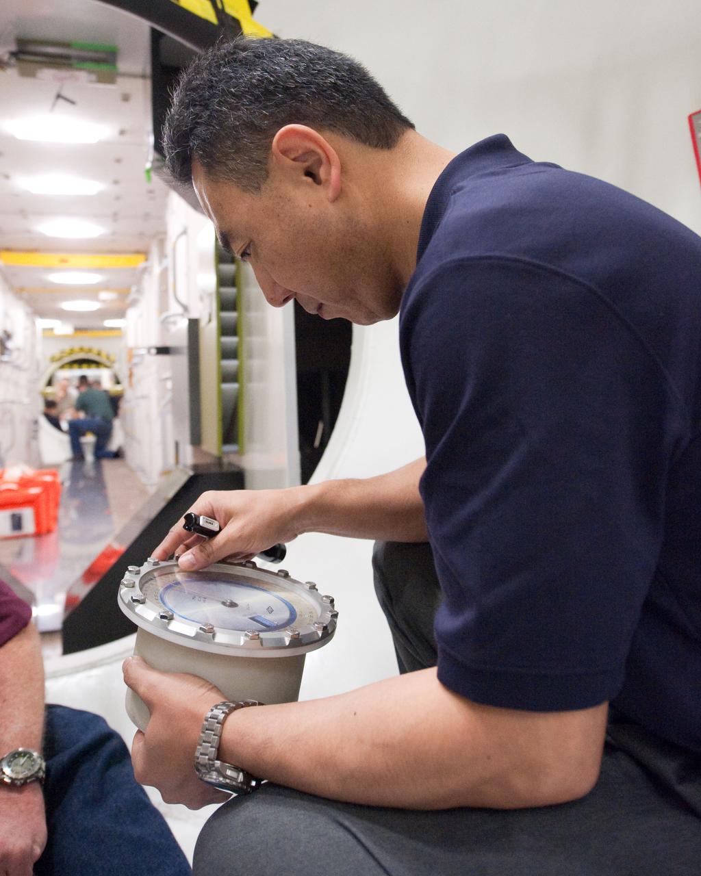 PHOTO DATE:  01-26-11 LOCATION:   Bldg. 9NW - ISS Mockups SUBJECT:  Expedition 29 JAXA astronaut Satoshi Furukawa during Emergency Scenario Training WORK ORDER:   00374-BS__SATOSHIEMERTRAINING_01-26-11 PHOTOGRAPHER:   BILL STAFFORD