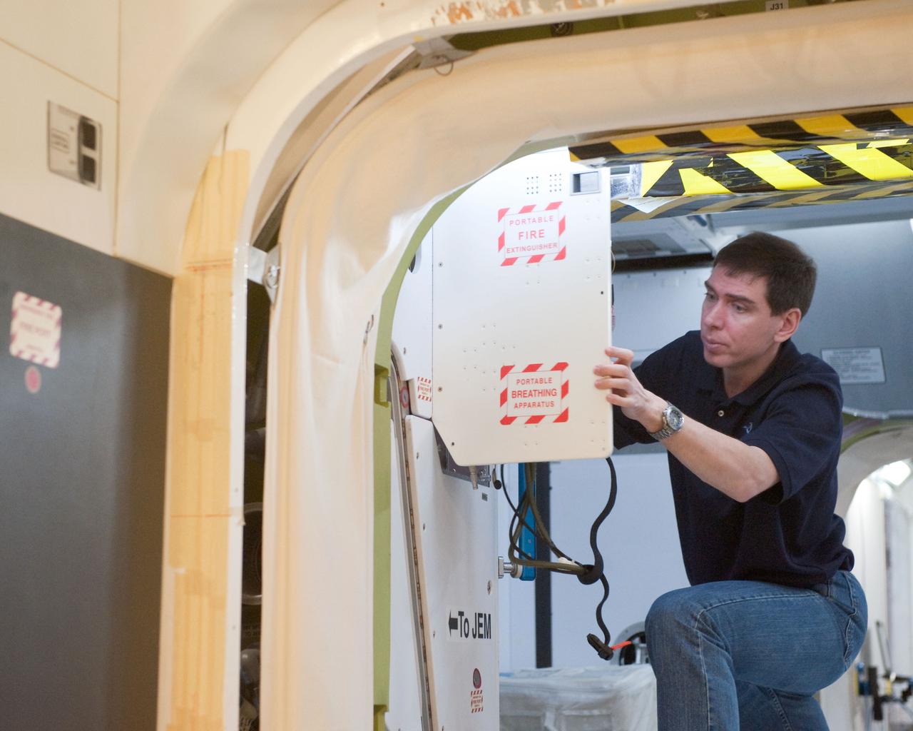 PHOTO DATE:  01-26-11 LOCATION:   Bldg. 9NW - ISS Mockups SUBJECT:  Expedition 29 JAXA astronaut Satoshi Furukawa during Emergency Scenario Training WORK ORDER:   00374-BS__SATOSHIEMERTRAINING_01-26-11 PHOTOGRAPHER:   BILL STAFFORD